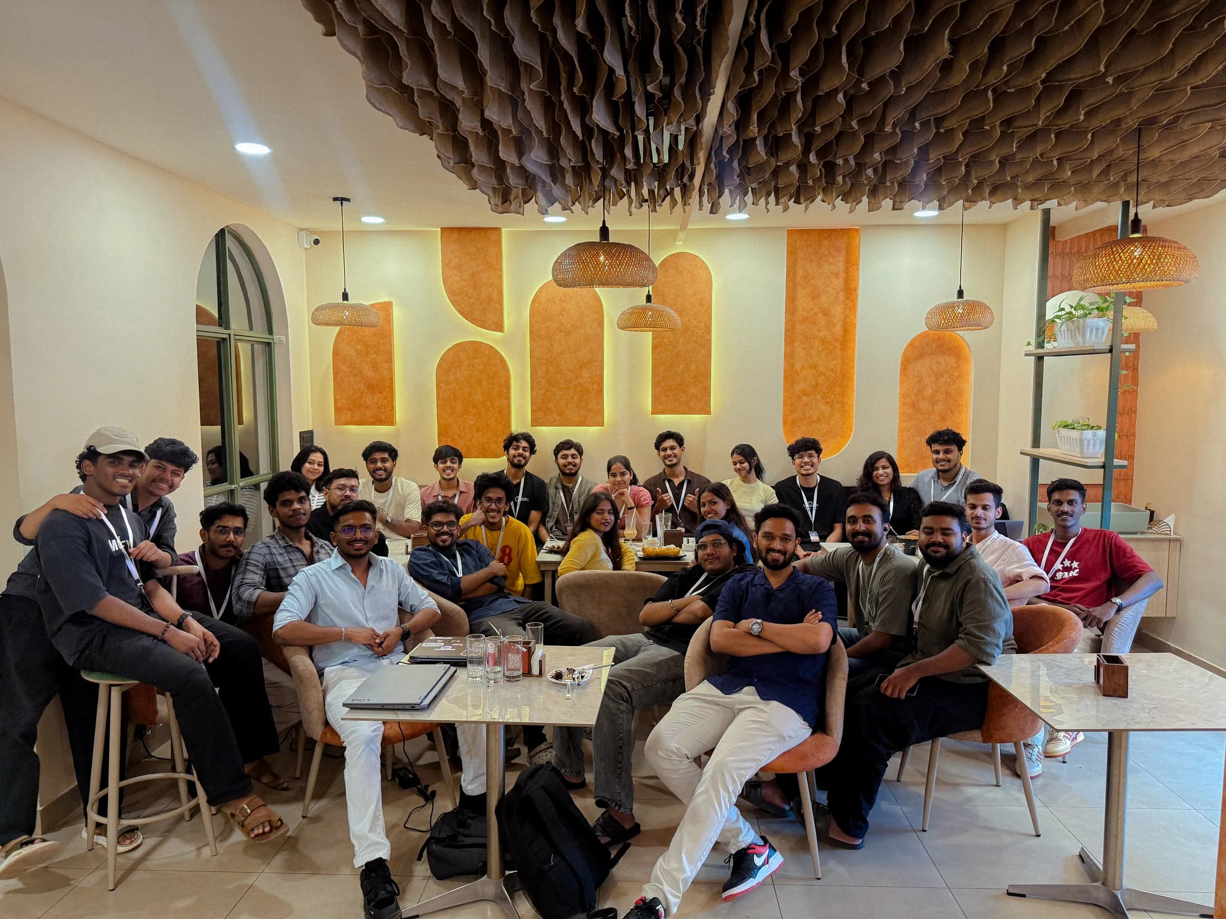 Robin Francis with the Devin & Clay builder community at The MudBrew Cafe in Kochi