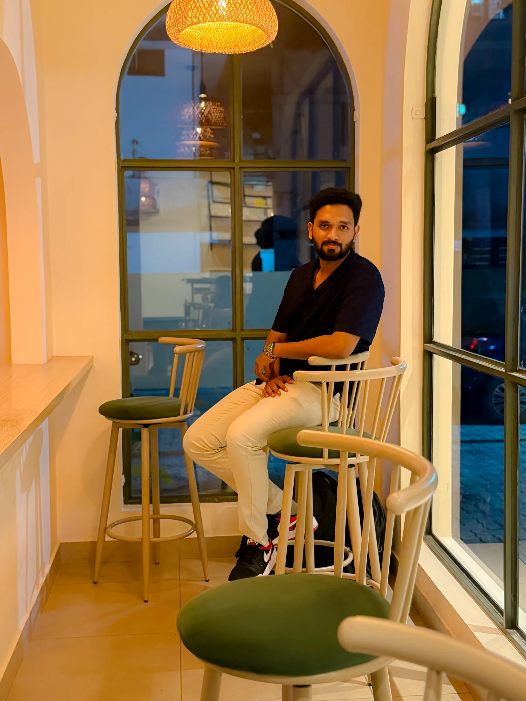 Robin Francis seated at The MudBrew Cafe during the Devin & Clay gathering in Kochi