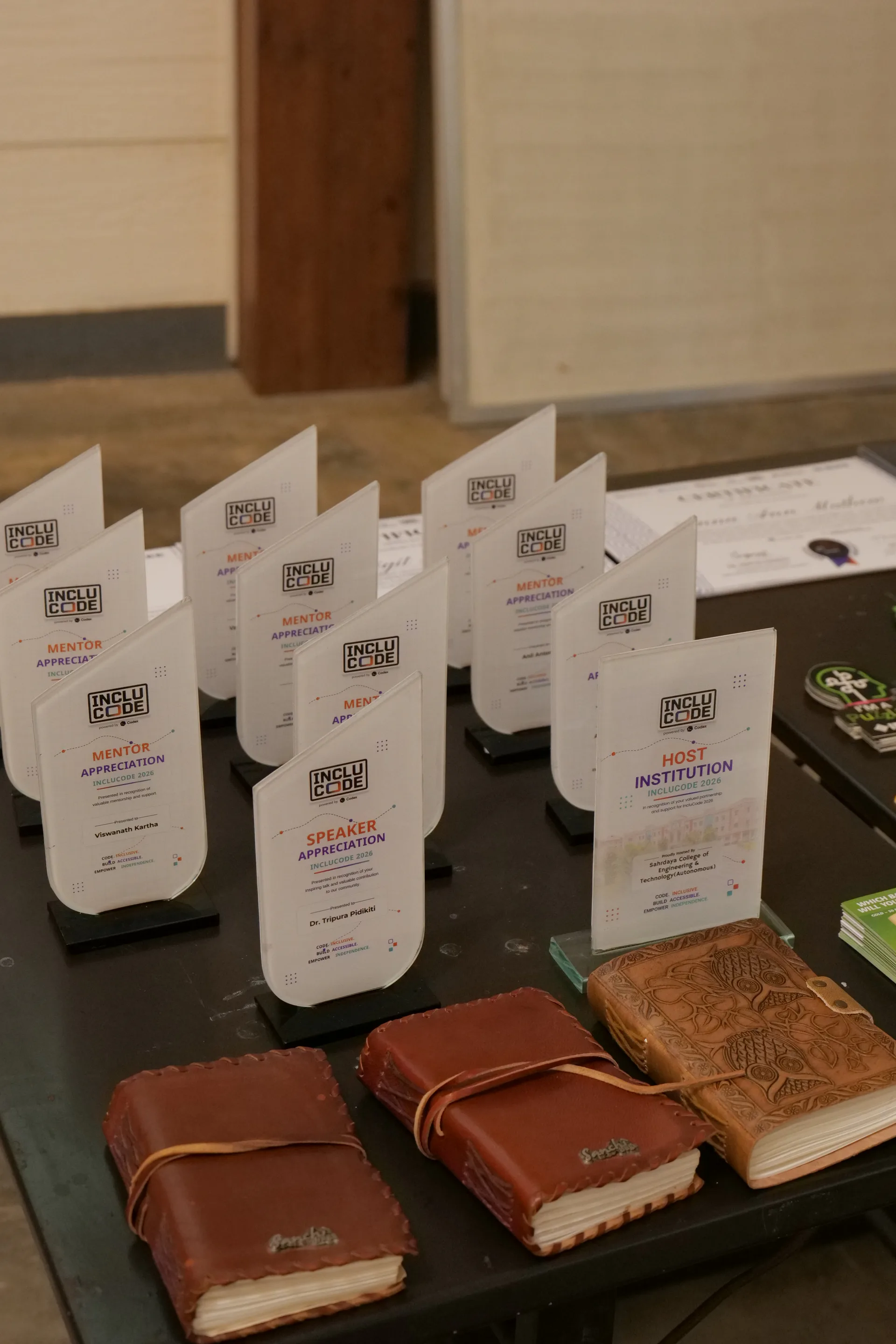 INCLUCODE 2026 mentor, speaker, and host appreciation awards displayed with handmade gifts