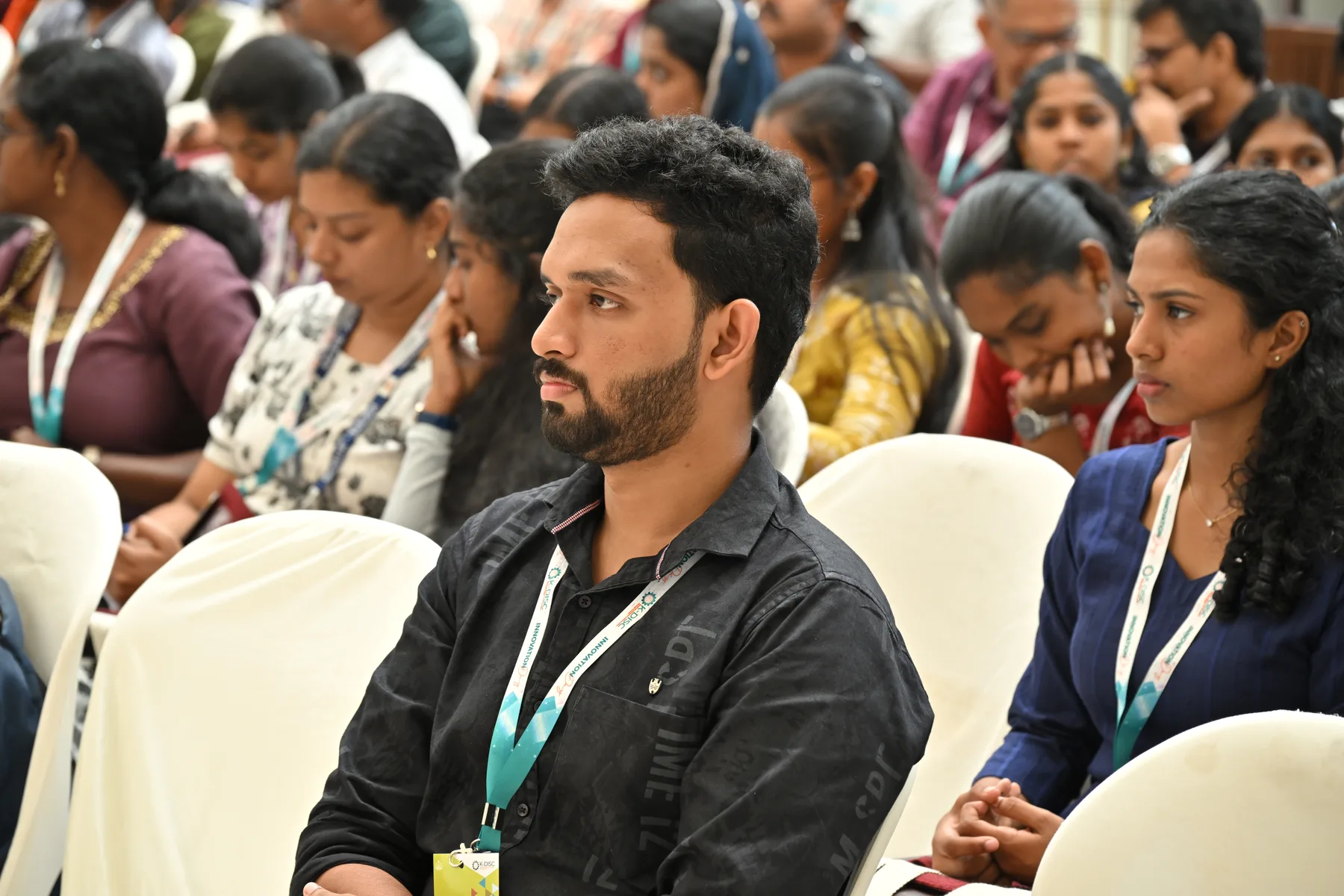 Robin Francis seated among participants at an inclusive innovation event