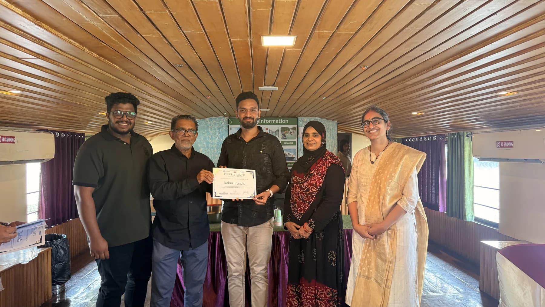 Robin Francis and organizers during a certificate handoff