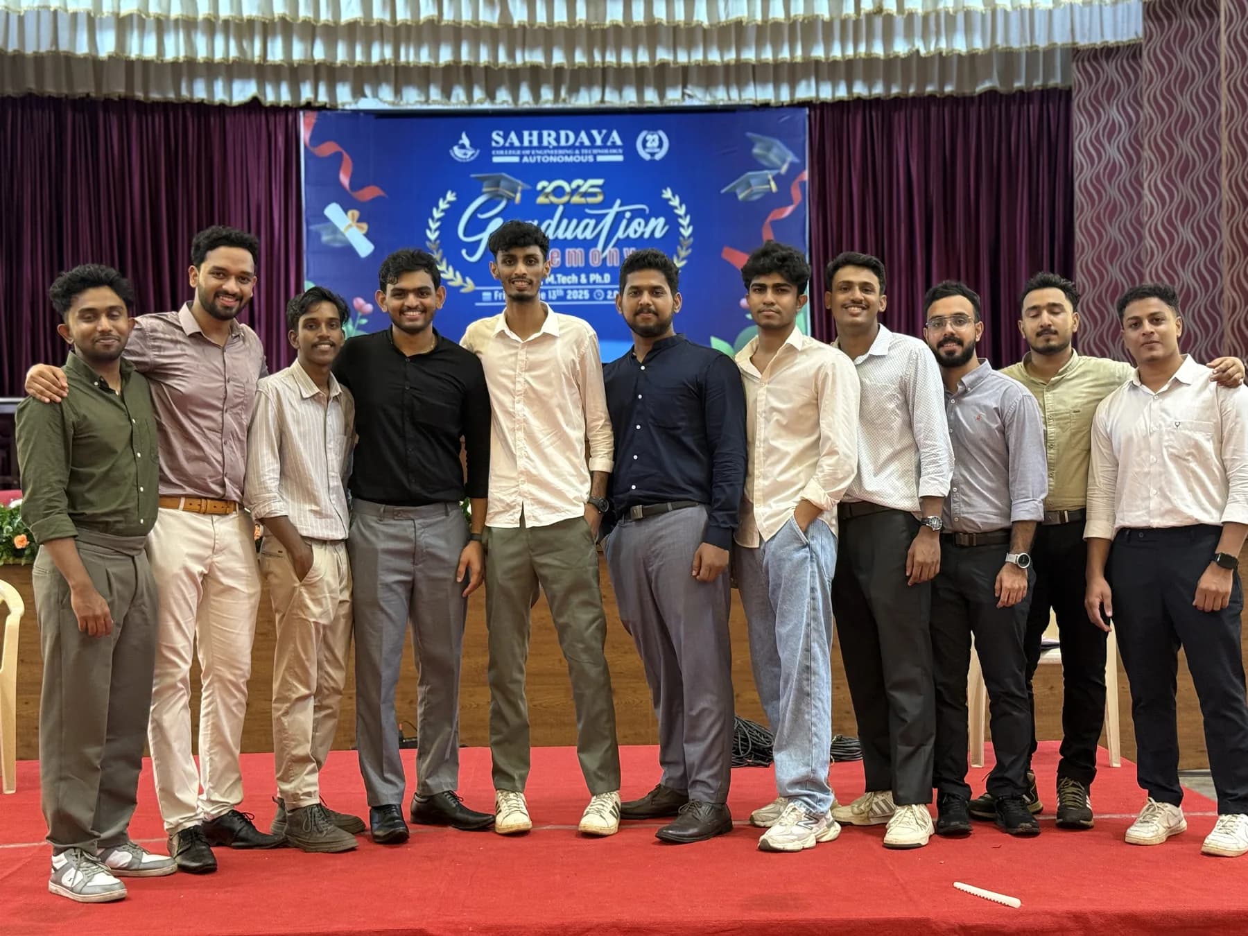 Robin Francis with a student team on the Sahrdaya auditorium stage
