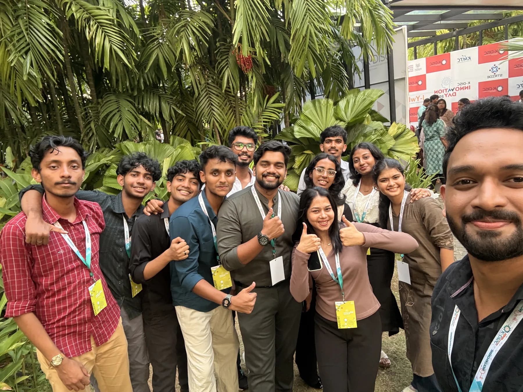 Robin Francis taking a group selfie with technology event attendees