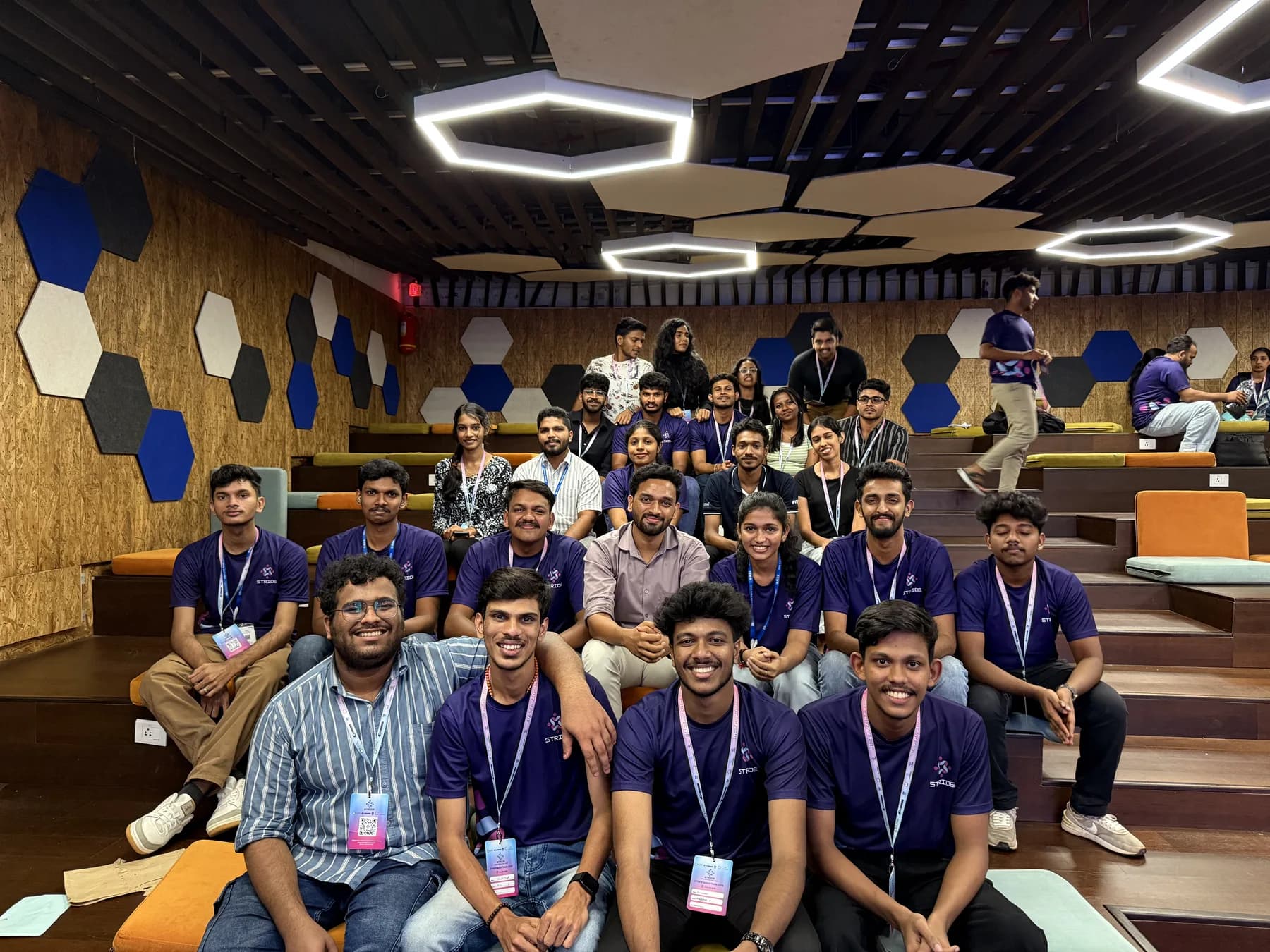 Technology community group photo in an auditorium