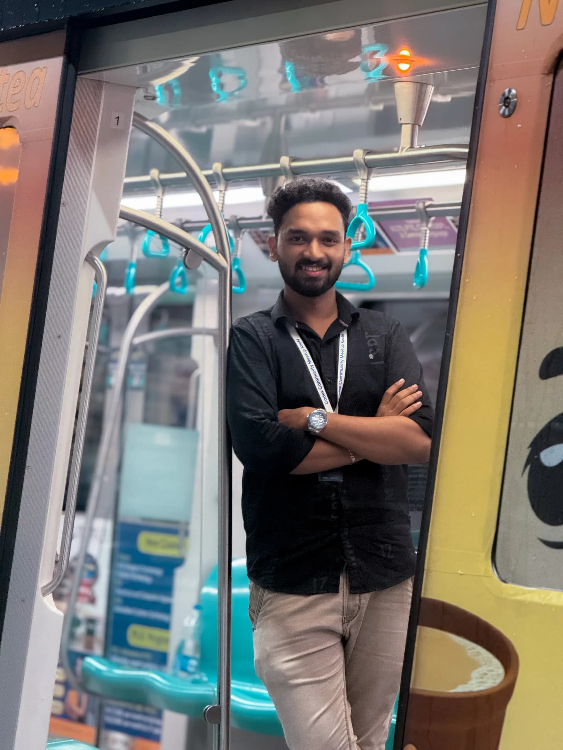 Robin Francis standing in the doorway of a Kochi Metro train during Codex Nightline