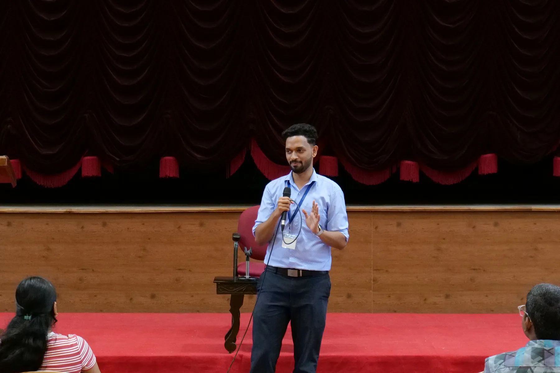 Robin Francis speaking on stage during an IEEE Sahrdaya program