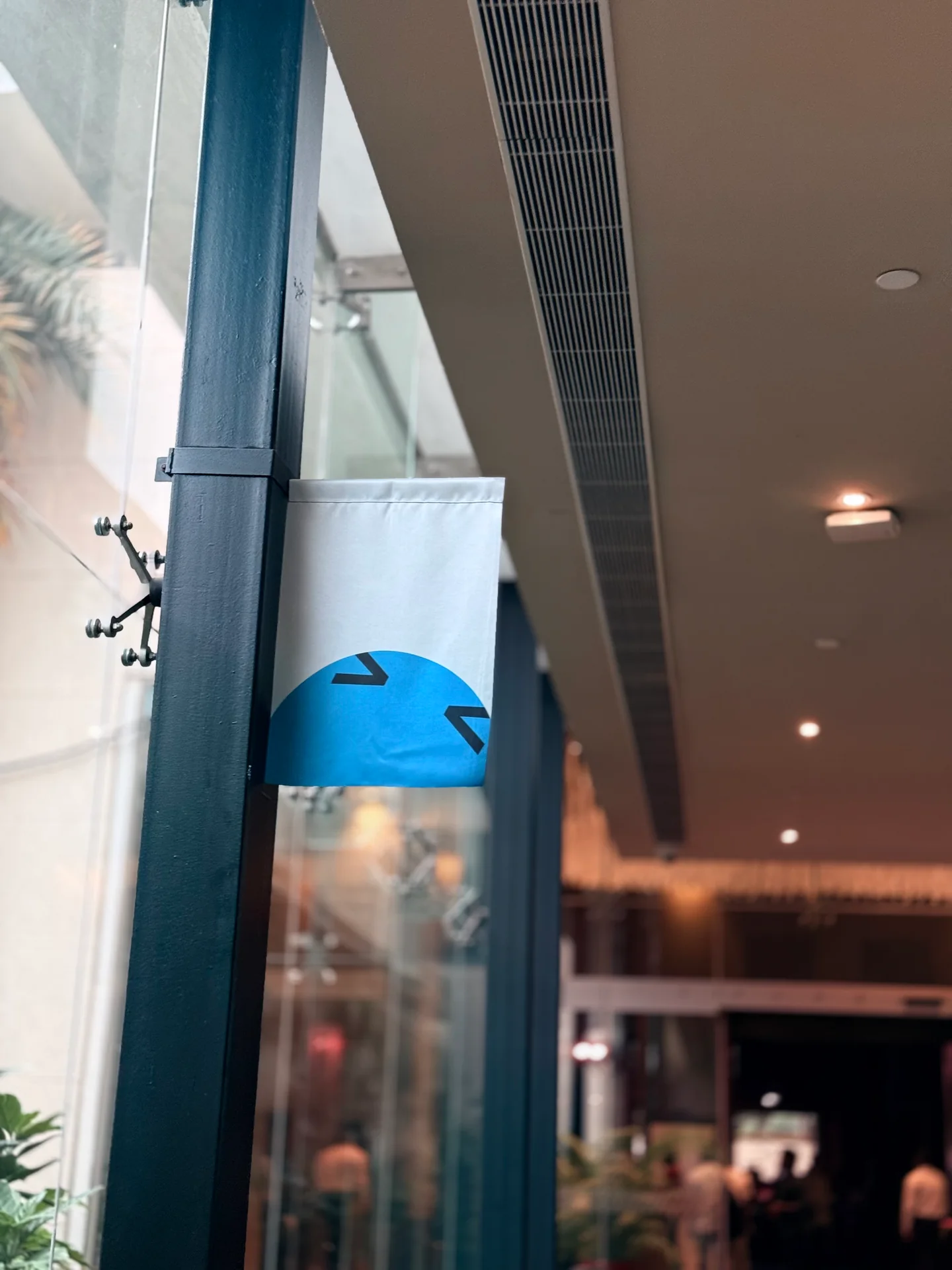 An OpenAI DevDay character displayed by the venue window during Robin Francis's Bengaluru visit