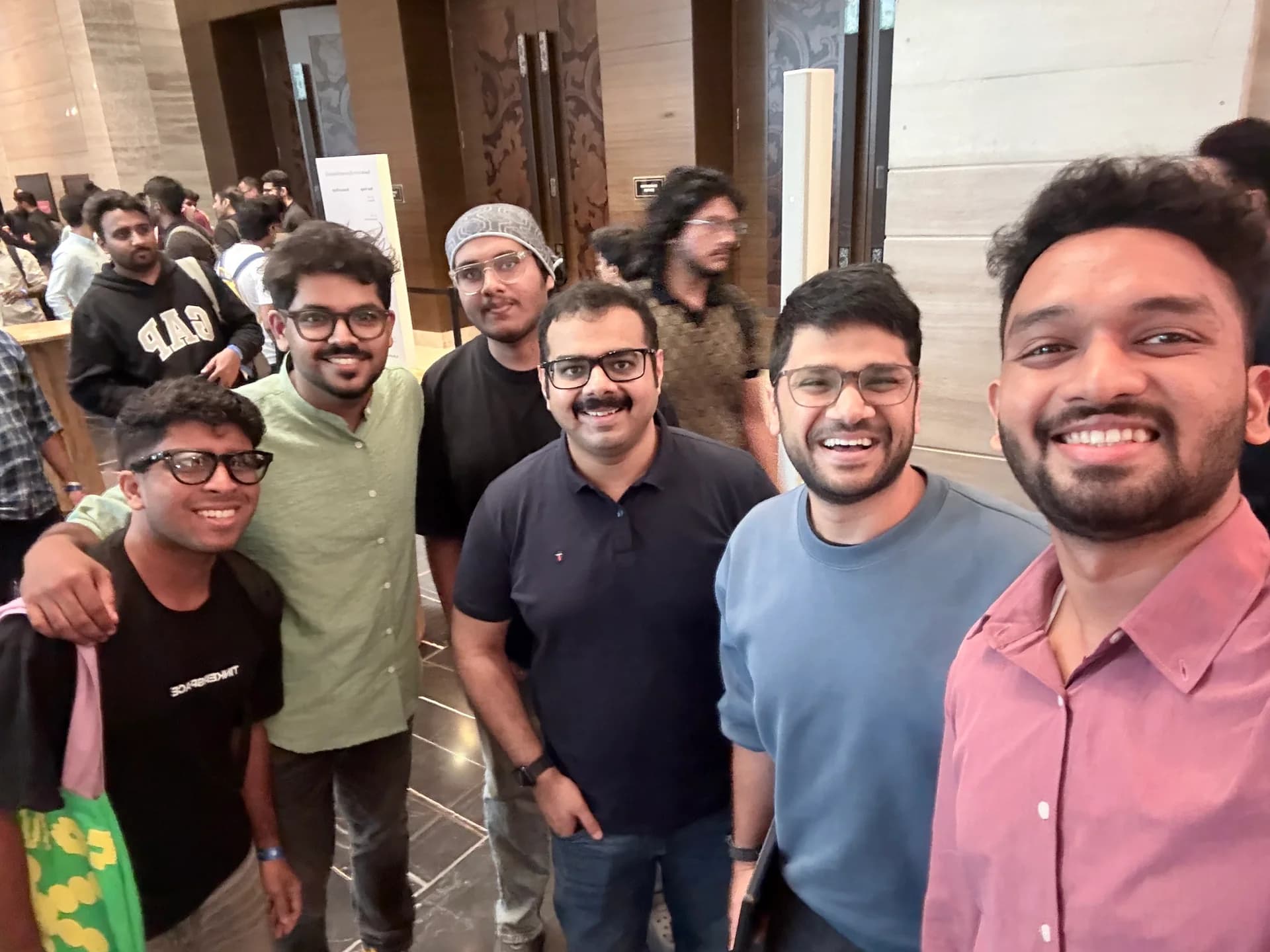 Robin Francis taking a group selfie with fellow attendees at OpenAI DevDay Exchange Bengaluru